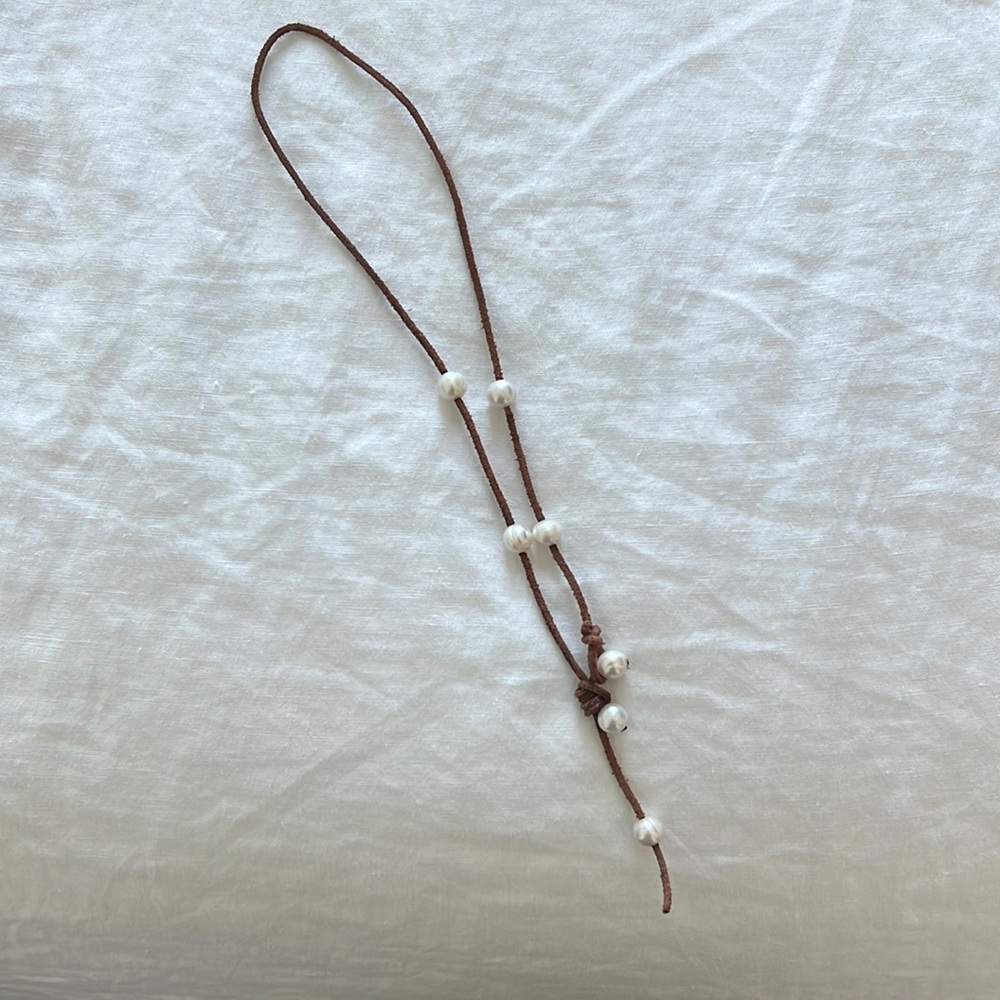 Pearl and brown leather necklace. 17”